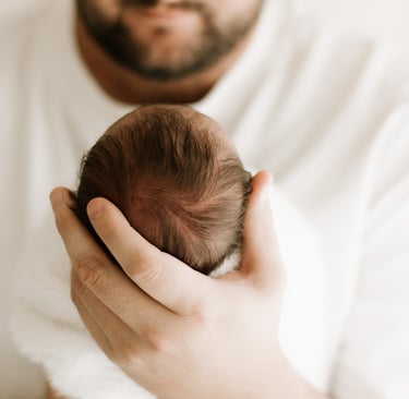 newborn photography Adelaide capturing dad holding baby naturally