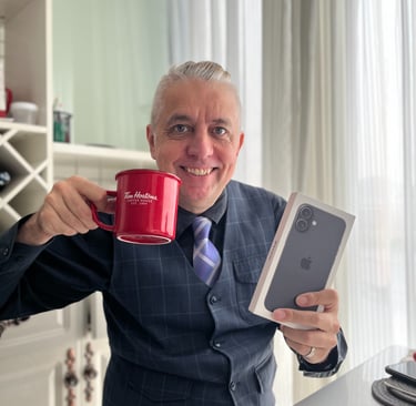 a man in a suit and tie holding a cup of coffee