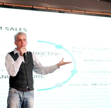 a man standing in front of a presentation on a presentation