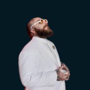 a bearded bearded bearded man in a white suit