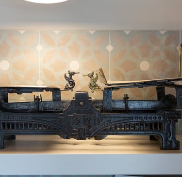 Antique cast iron scale used as a decorative detail in Villa Skyphos kitchen