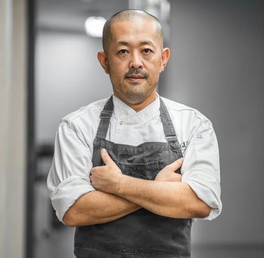 A restaurant chef is tired and frustrated after working a long shift and still has a lot of work.