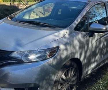 Silver Honda representing Asheville locksmith services including rekeying, ignition repair, and key fob replacement