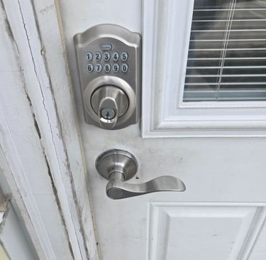A white door with a keypad lock representing Jack’s Locksmith local keypad door lock services