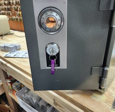 Grey commercial safe with combination dial and key lock on the front
