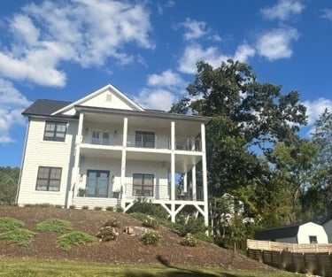 White modern home off of Main Street representing residential locksmith in Weaverville, NC,  including lockouts & key copying