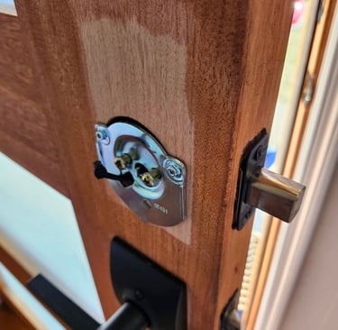 Wood door being repaired for residential locksmith door repair service in Boone, NC