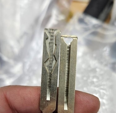 Two house keys side by side for residential key duplication service
