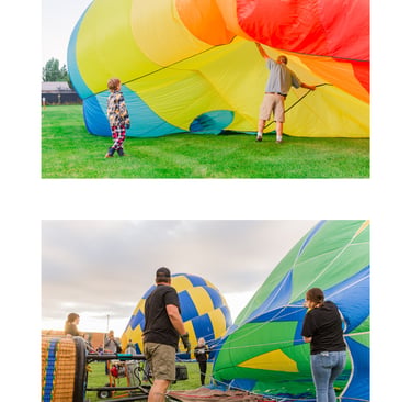 Ground crew and spectators preparing colorful hot air balloons for flight at an outdoor festival.