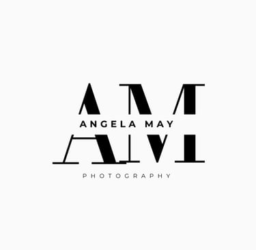 Angela May Photography logo featuring modern black serif initials AM with a creative mirrored reflection.