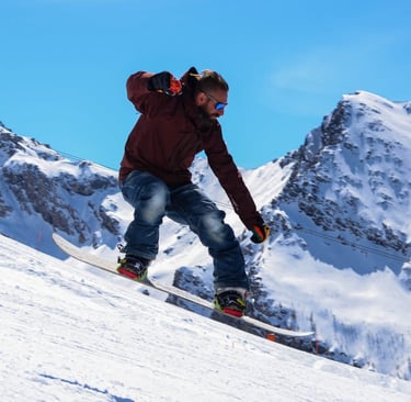 Ollie e salto in pista con lo snowboard