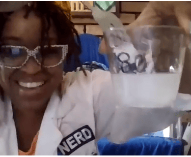Shenell is pictured during a science experiment demo for a classroom via zoom