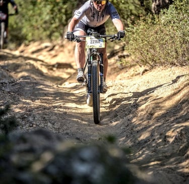 a technical downhill section during XCO race
