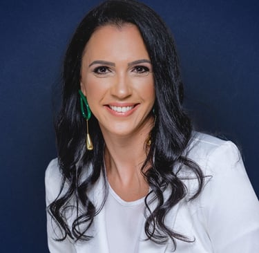 a woman with long black hair and earrings