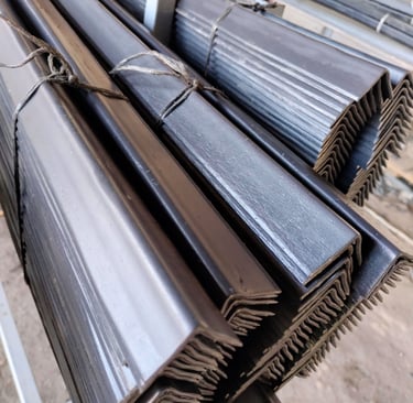 a bunch of metal pipes and pipes are stacked on top of each other