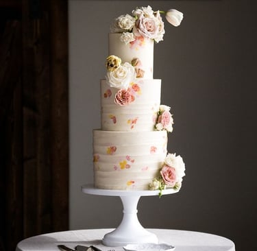 Hand-painted pastel wedding cake made for a destination wedding in Bozeman Montana