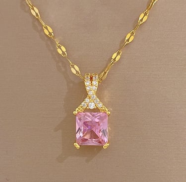 a pink princess cut diamond necklace with a pink and gold necklace