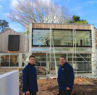 Builders working on house