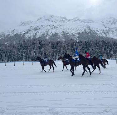 Horses lining up to race on frozen Lake St. Moritz at the White Turf Horse Races in in Switzerland