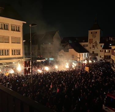 Torches being carried through the center of Liestal Switzerland at Chienbase