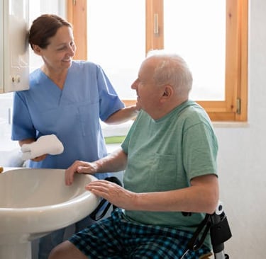 Occupational therapy: helping improve patient's independence with hygiene/grooming tasks.