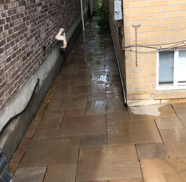 Flagstone walkway leading into backyard