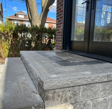 Interlock concrete paver stone steps in backyard