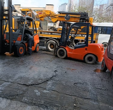 a forklift truck with a forklift truck in the background