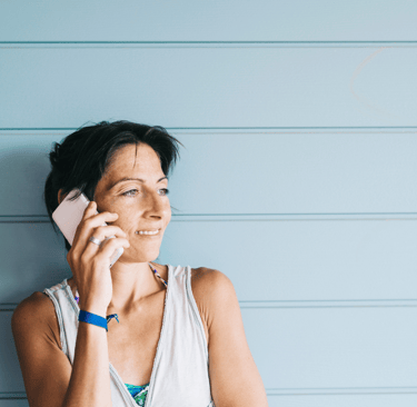 A Woman making a call to Kayuh Spa