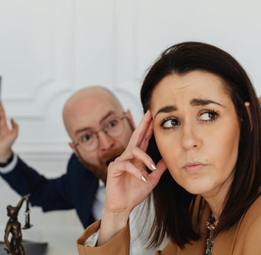 a man counselor yelling at a woman who is in drug rehab