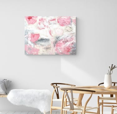 Painting of abstract pink roses on wall in dining room with Wegner chairs