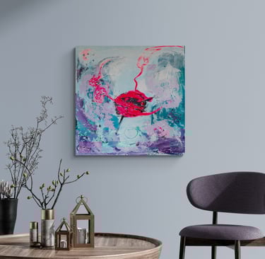 Neon pink and teal painting on wall next to chair.