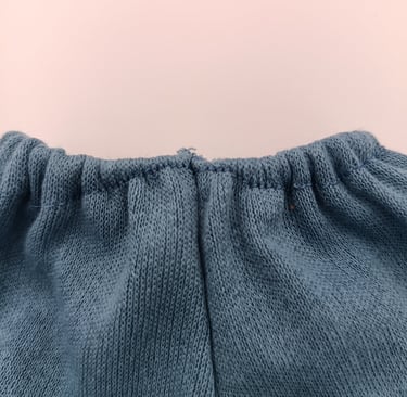 Flaw in elastic waistband of trousers