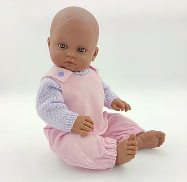 Minikane doll wearing Baby Born outfit