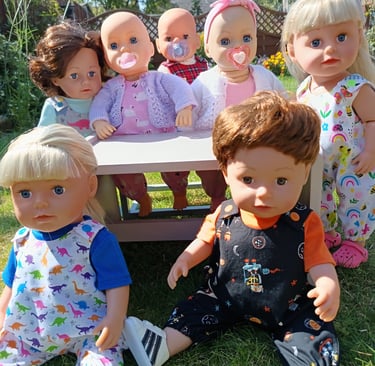 Zapf baby dolls outside dressed for summer