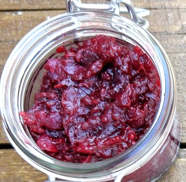 Jar containing red currant relish