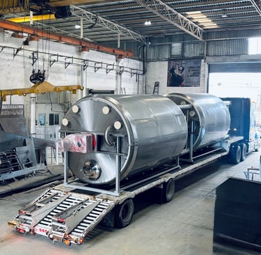 a train car being loaded with a tank
