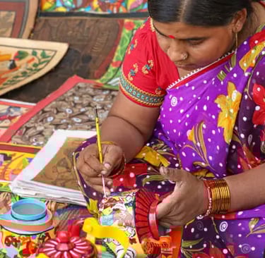 Madhubani art featuring peacocks and Hindu deities.