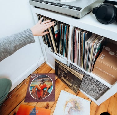 Founder sharing rare vinyl finds with fellow collectors inside the Vinyl Universe store