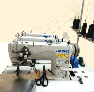 Tanori Hair triple-headed wefting machine used for strong and durable hair weft construction.