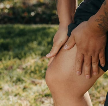 a man with a tattoo on his leg and a tattoo on his leg
