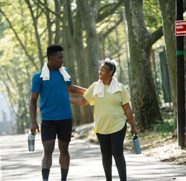 a man and woman walking down a street