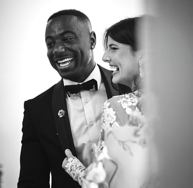 Married couple smiling at wedding