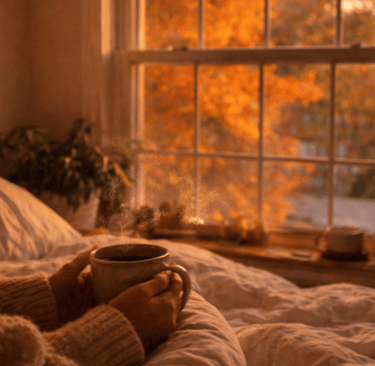 Slow living journal scene of autumn leaves in warm golden light