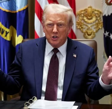a man in a suit and tie is sitting at a table