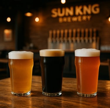 three craft beers on wooden bar top