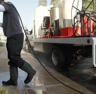 pressure washing services pressure washer worker cleaning commercial walkway
