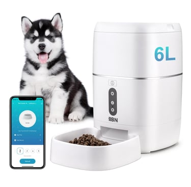 a dog is sitting next to a phone