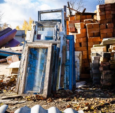 construction debris stacked on empty lot
