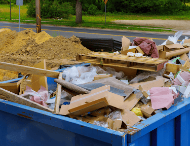trash pile in construction roll of container
